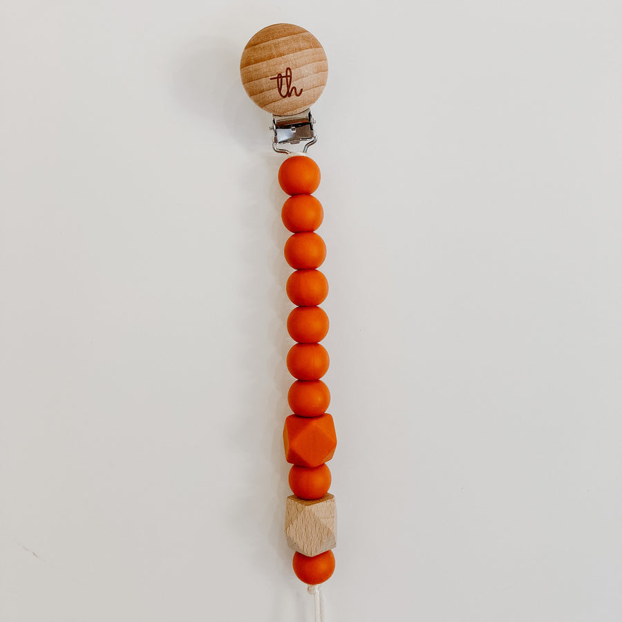 Jolie Pacifier Clip in Burnt Orange