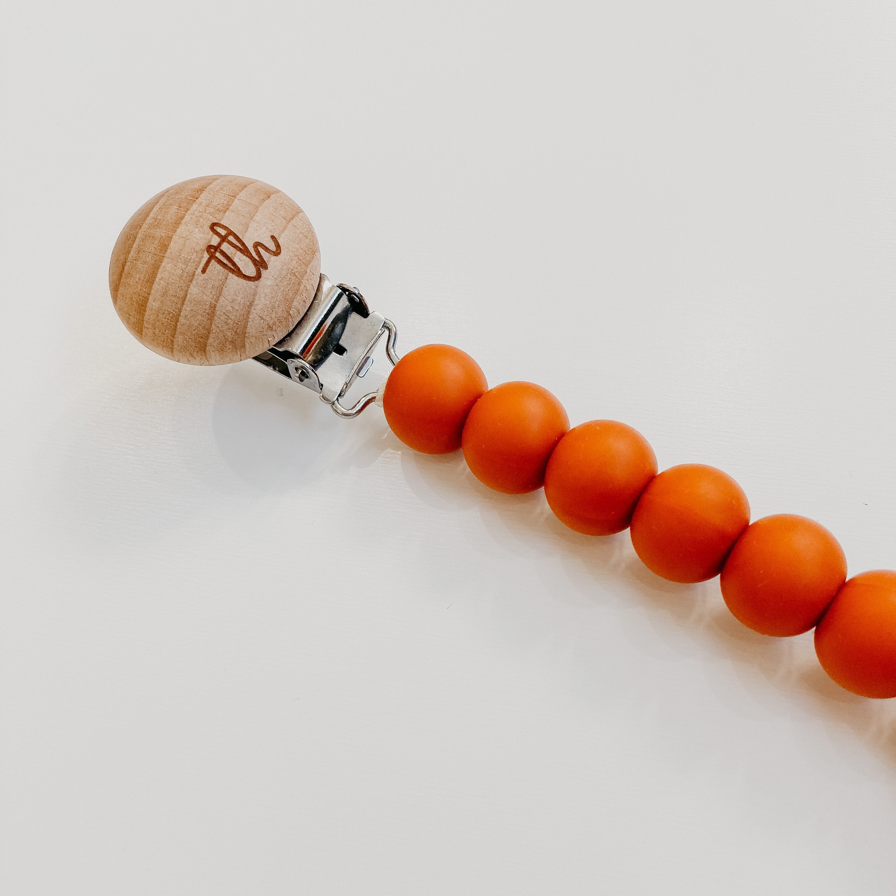 Jolie Pacifier Clip in Burnt Orange