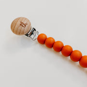 Jolie Pacifier Clip in Burnt Orange